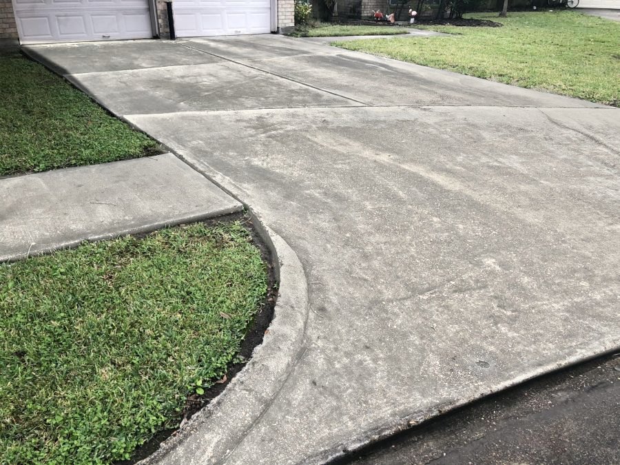 Clean concrete driveway and curb