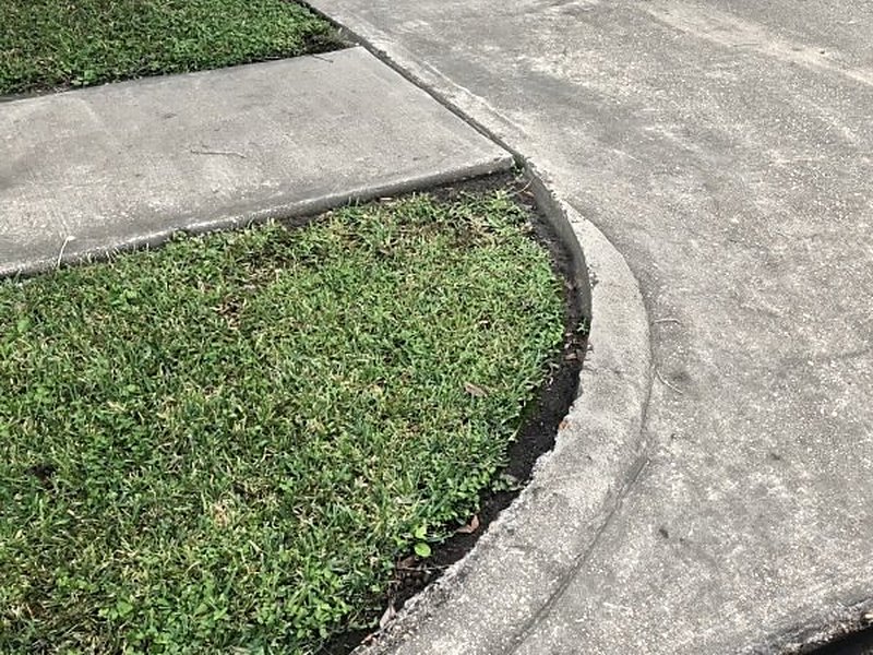 Clean sidewalk and curb after pressure washing